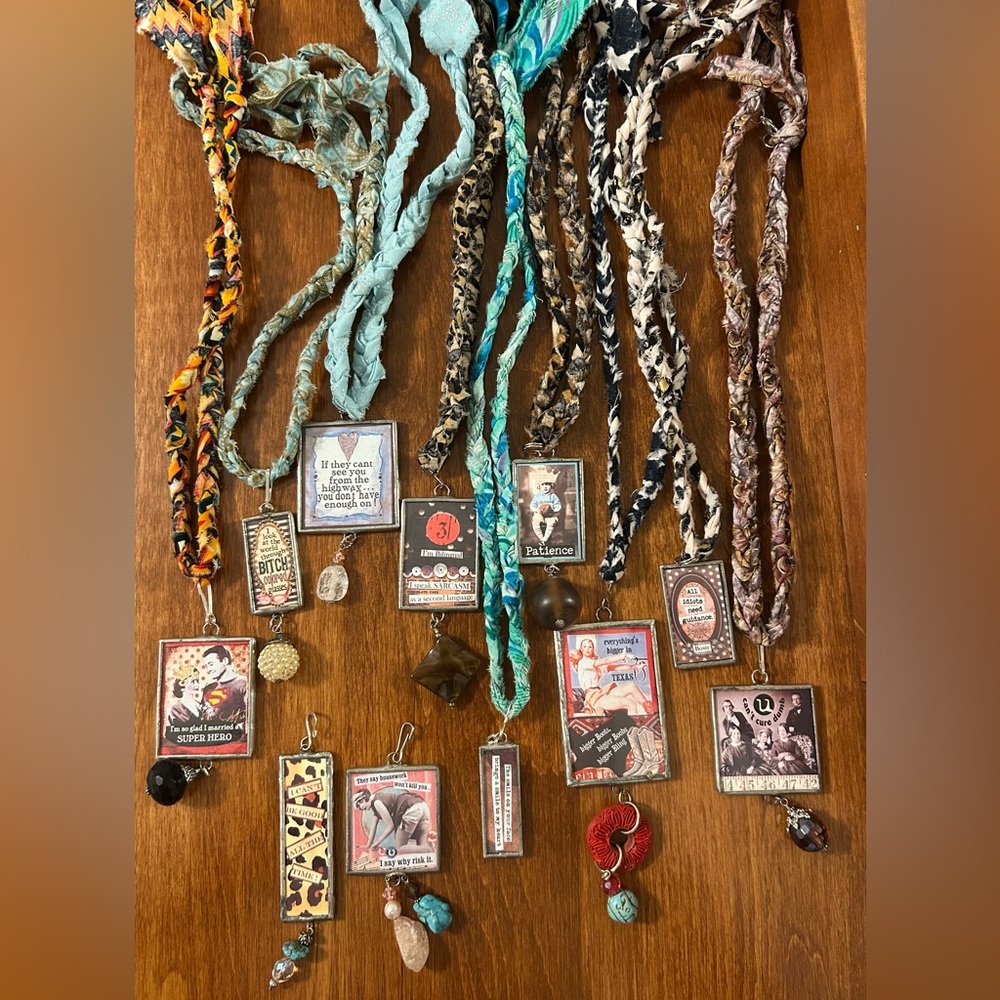 Art By Amy pendants on hand tied necklaces.